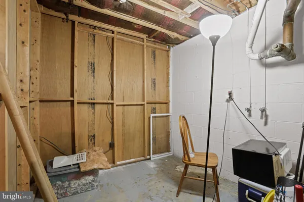 a bedroom with furniture and a wooden floor