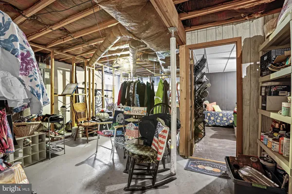 front view of a house with a yard and trees