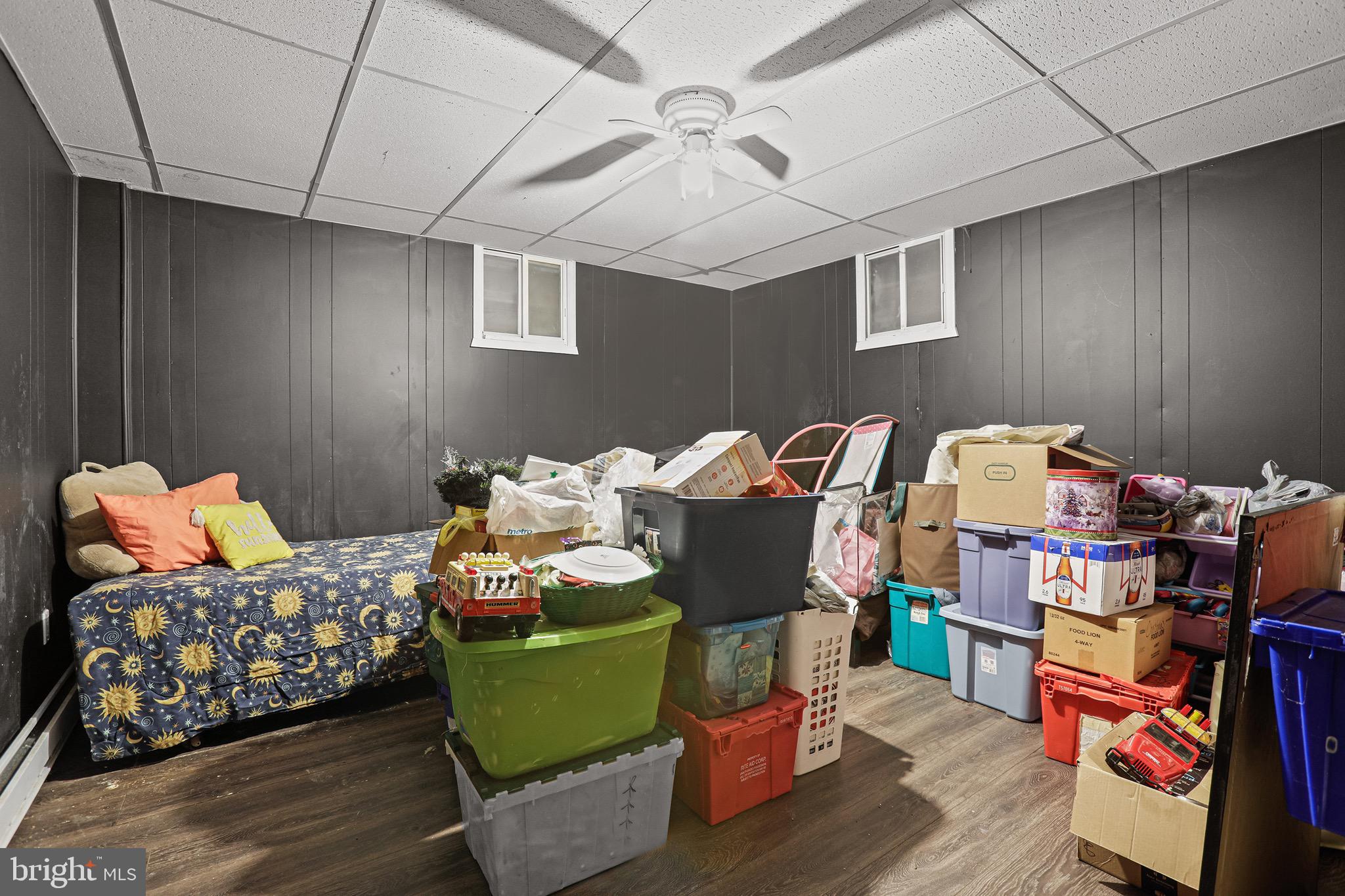 3504 Wakefield Street Colonial Beach, VA 22443 - Photo 32 of 53 a bedroom with furniture and a wooden floor