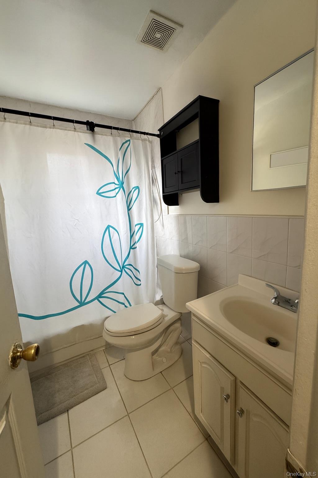 472 Sutter Avenue Brooklyn, NY 11207 - Photo 4 of 8 a bathroom with a sink a toilet and shower