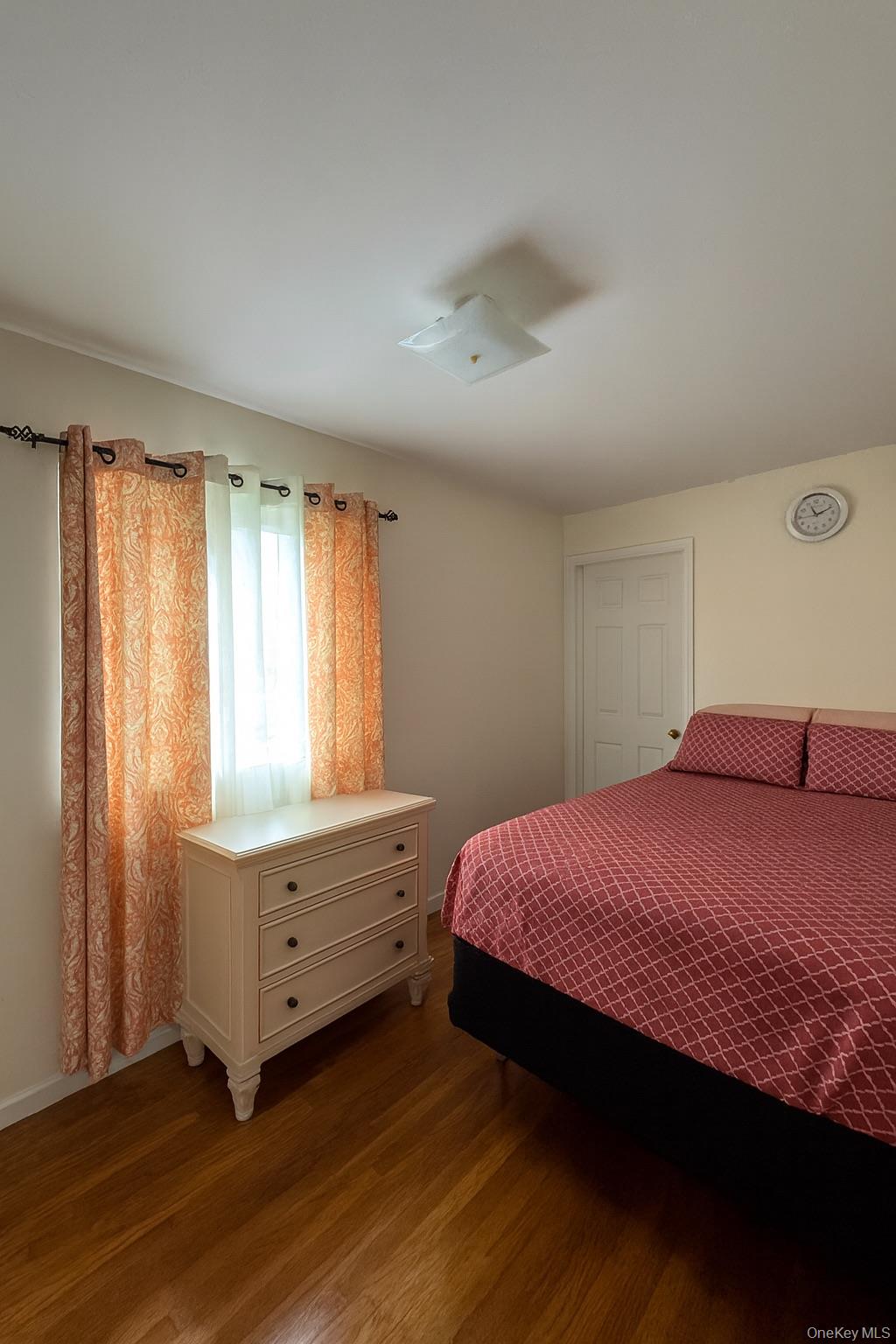 472 Sutter Avenue Brooklyn, NY 11207 - Photo 5 of 8 a bedroom with a bed and a window