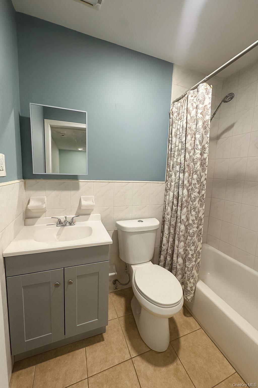 472 Sutter Avenue Brooklyn, NY 11207 - Photo 7 of 8 a bathroom with a sink toilet and shower