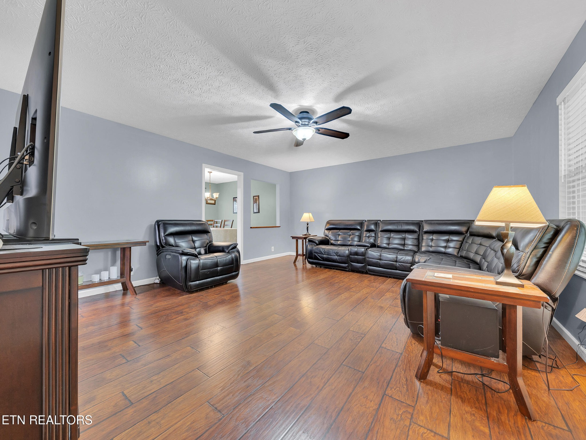 3342 Shagbark Road Powell, TN 37849 - Photo 7 of 32 a living room with furniture and a wooden floor