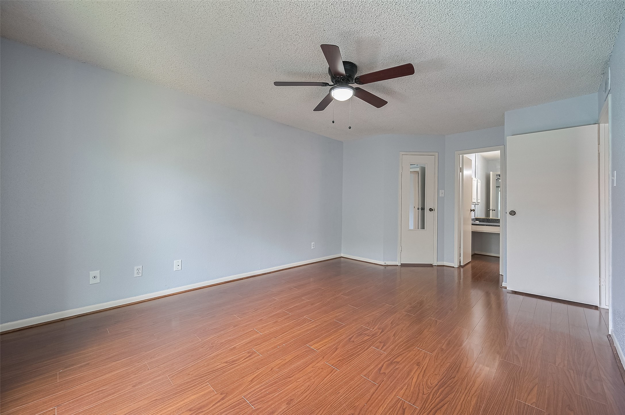 3100 Jeanetta Street, Unit 1104 Houston, TX 77063 - Photo 16 of 25 a view of an empty room and wooden floor