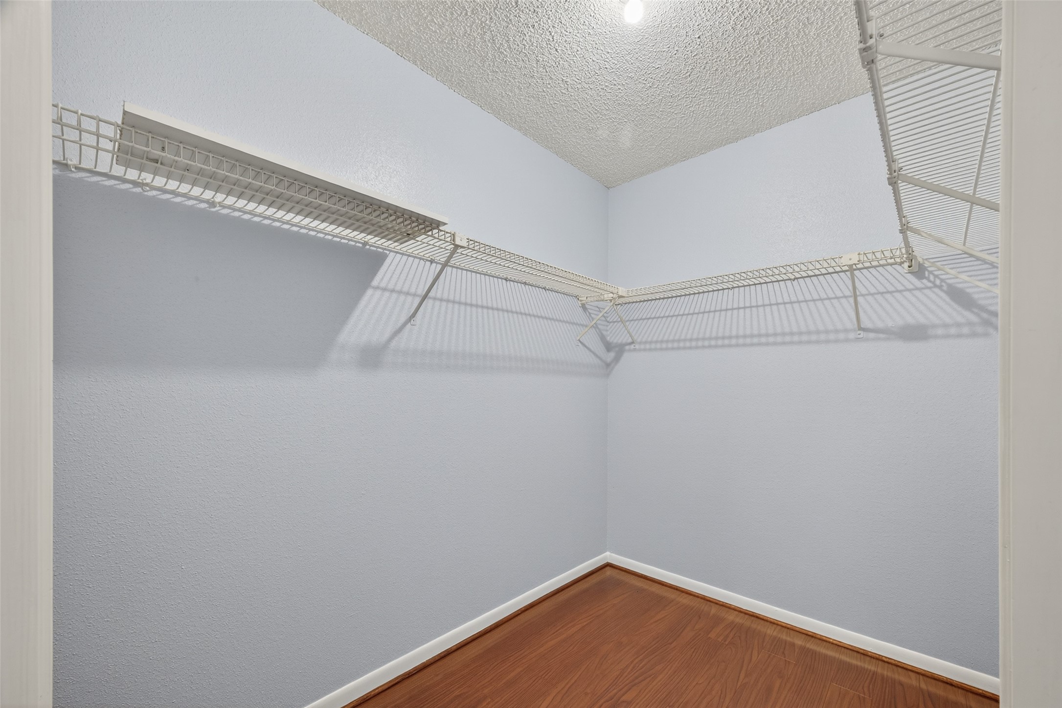 3100 Jeanetta Street, Unit 1104 Houston, TX 77063 - Photo 20 of 25 a view of a room with racks on the wall