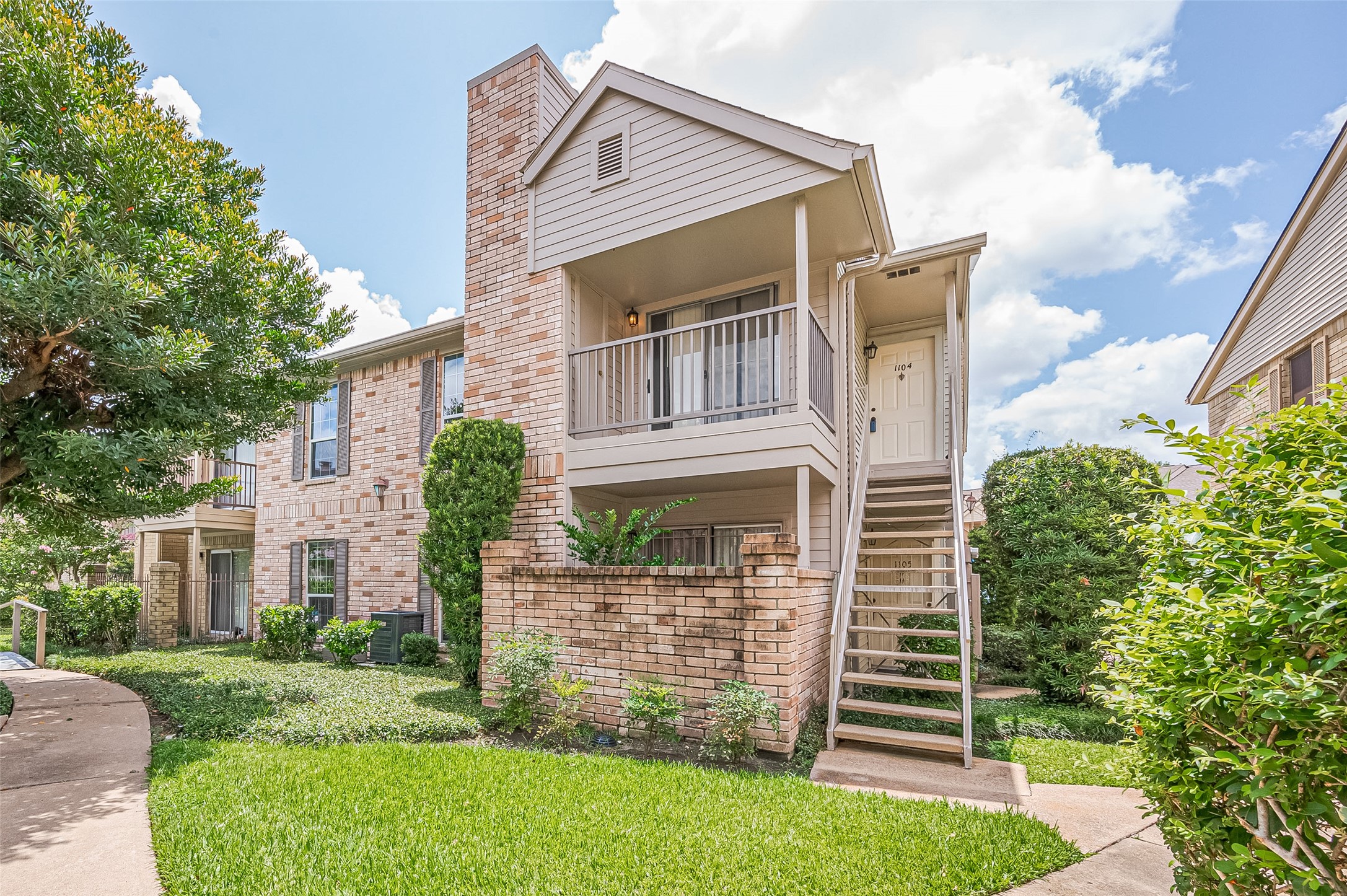 3100 Jeanetta Street, Unit 1104 Houston, TX 77063 - Photo 24 of 25 front view of a house with a yard