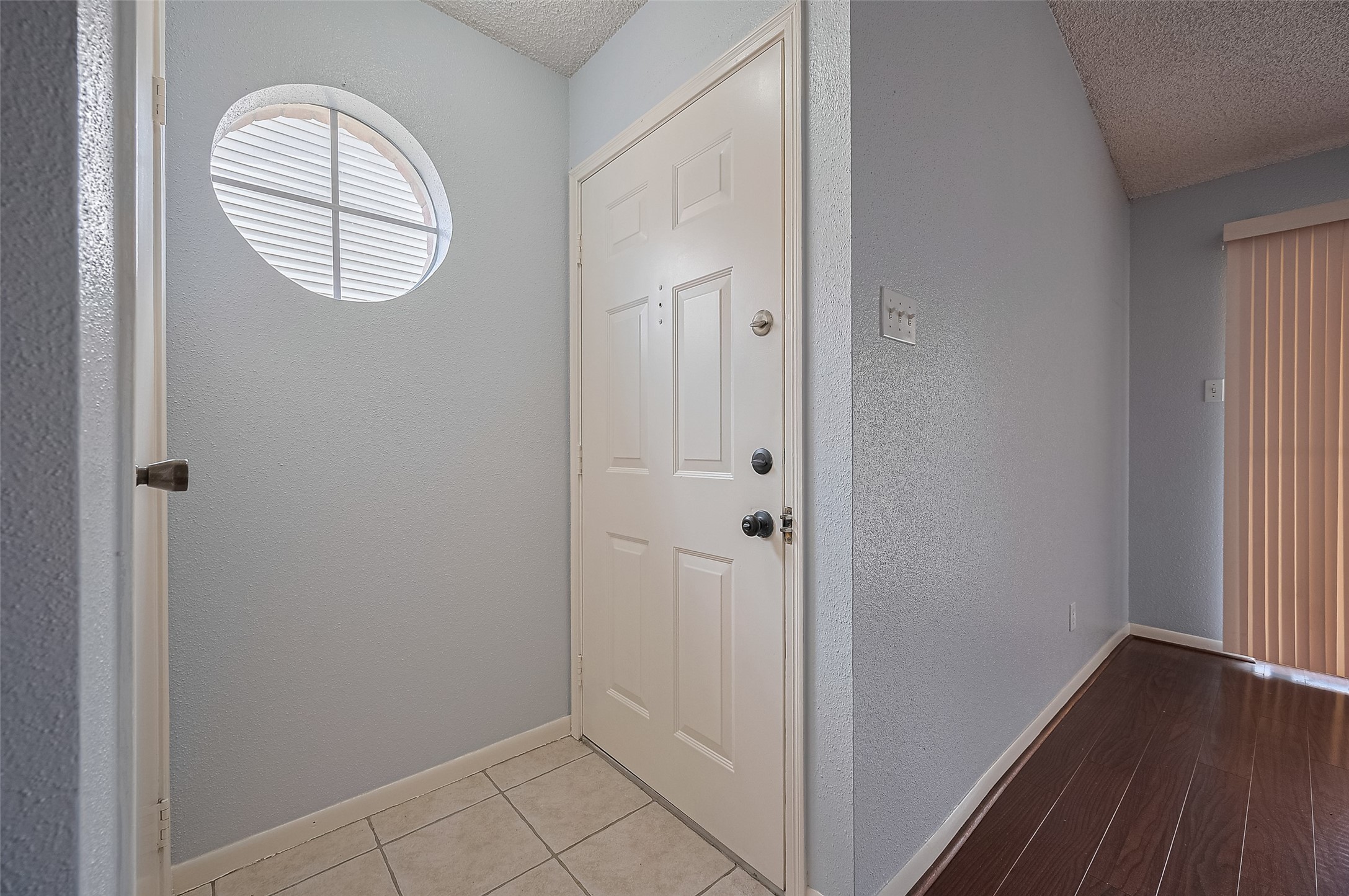 3100 Jeanetta Street, Unit 1104 Houston, TX 77063 - Photo 6 of 25 a view of a hallway with wooden floor and white walls