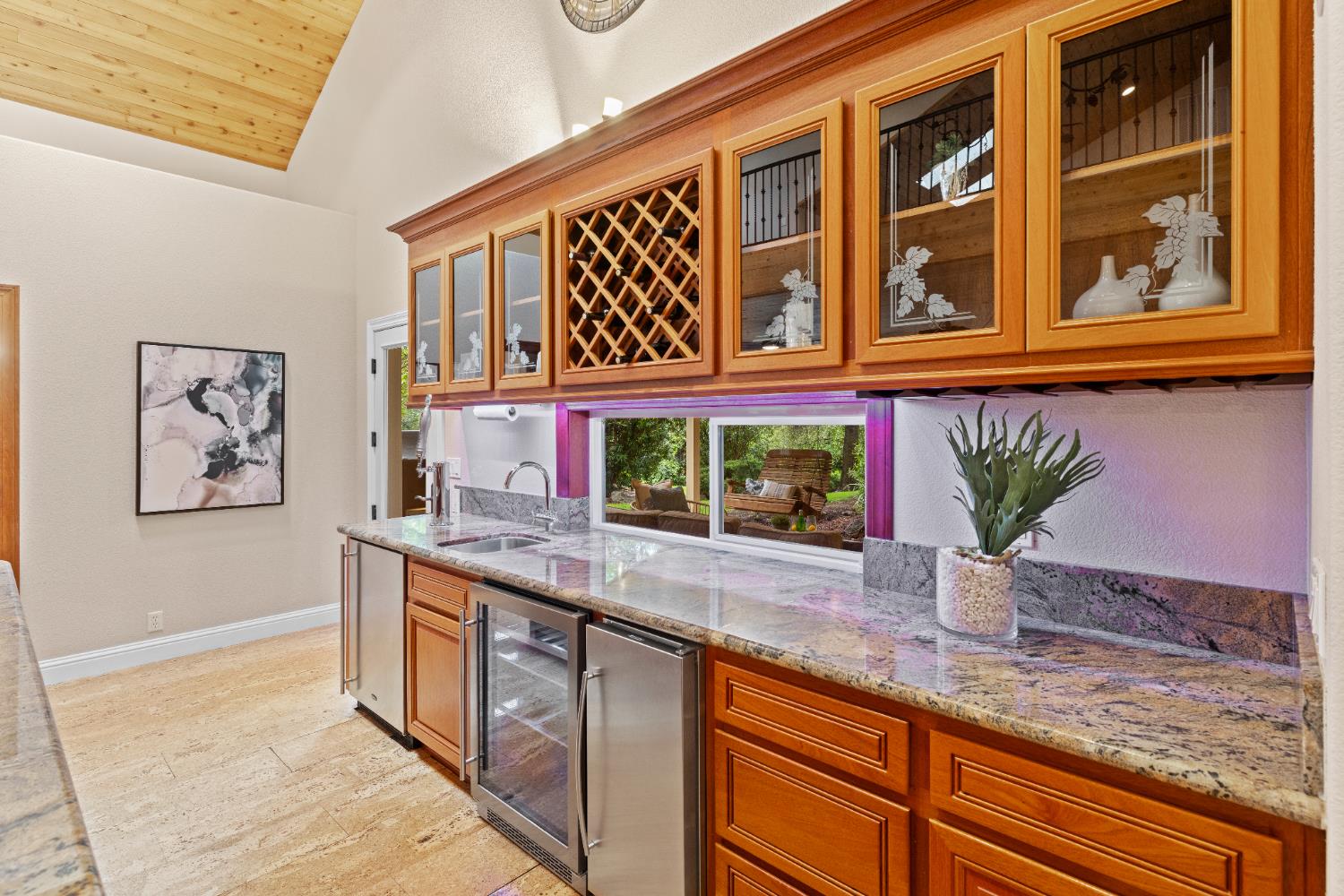 7396 Callison Road Penryn, CA 95663 - Photo 26 of 99 Kegorator on the end with the beverage/wine cooler in the middle and the ice maker. Custom etched glass on the mahogany cabinets.