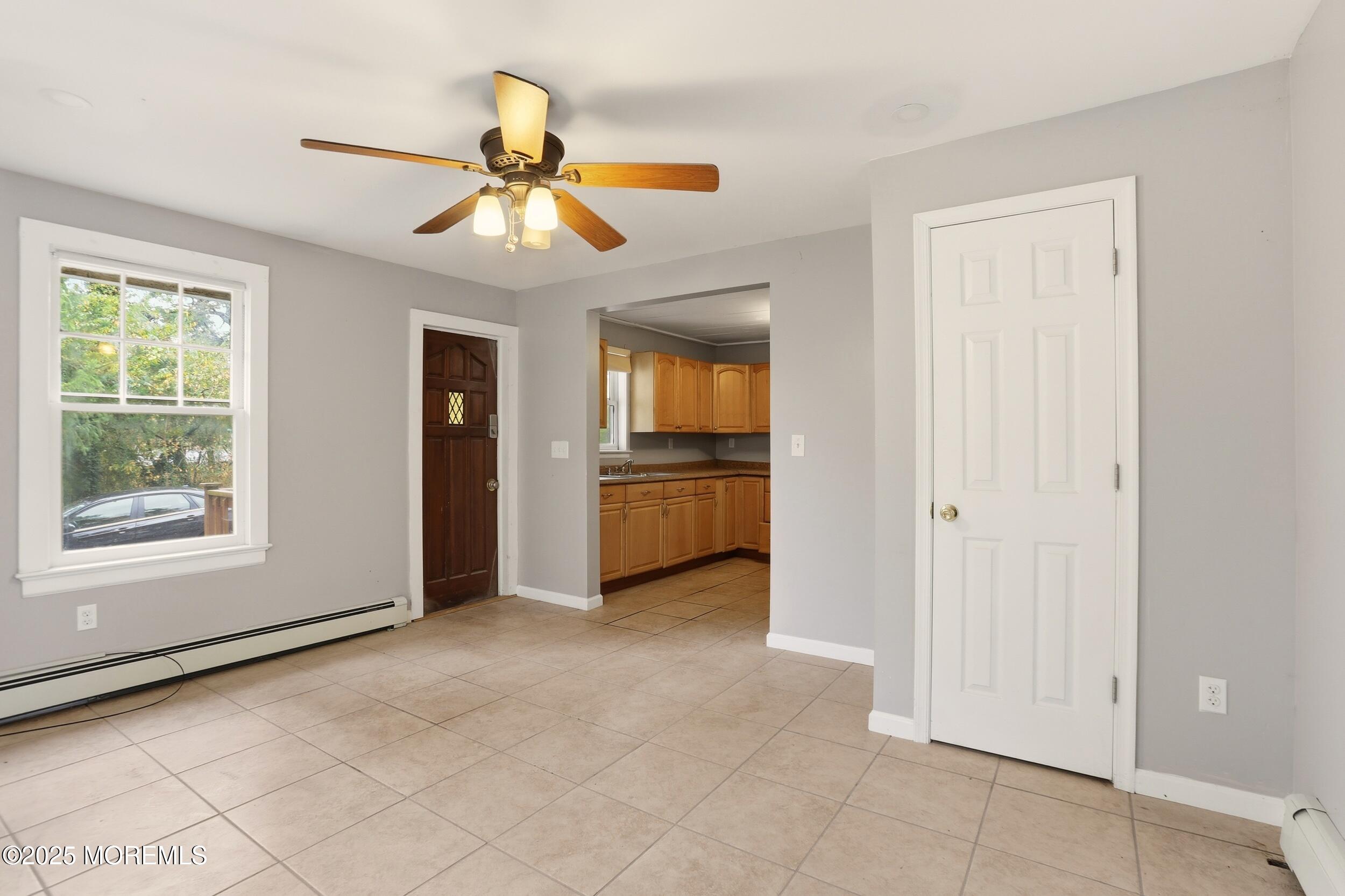 61 Cassville Road Jackson, NJ 08527 - Photo 13 of 20 a view of an empty room with window and kitchen view