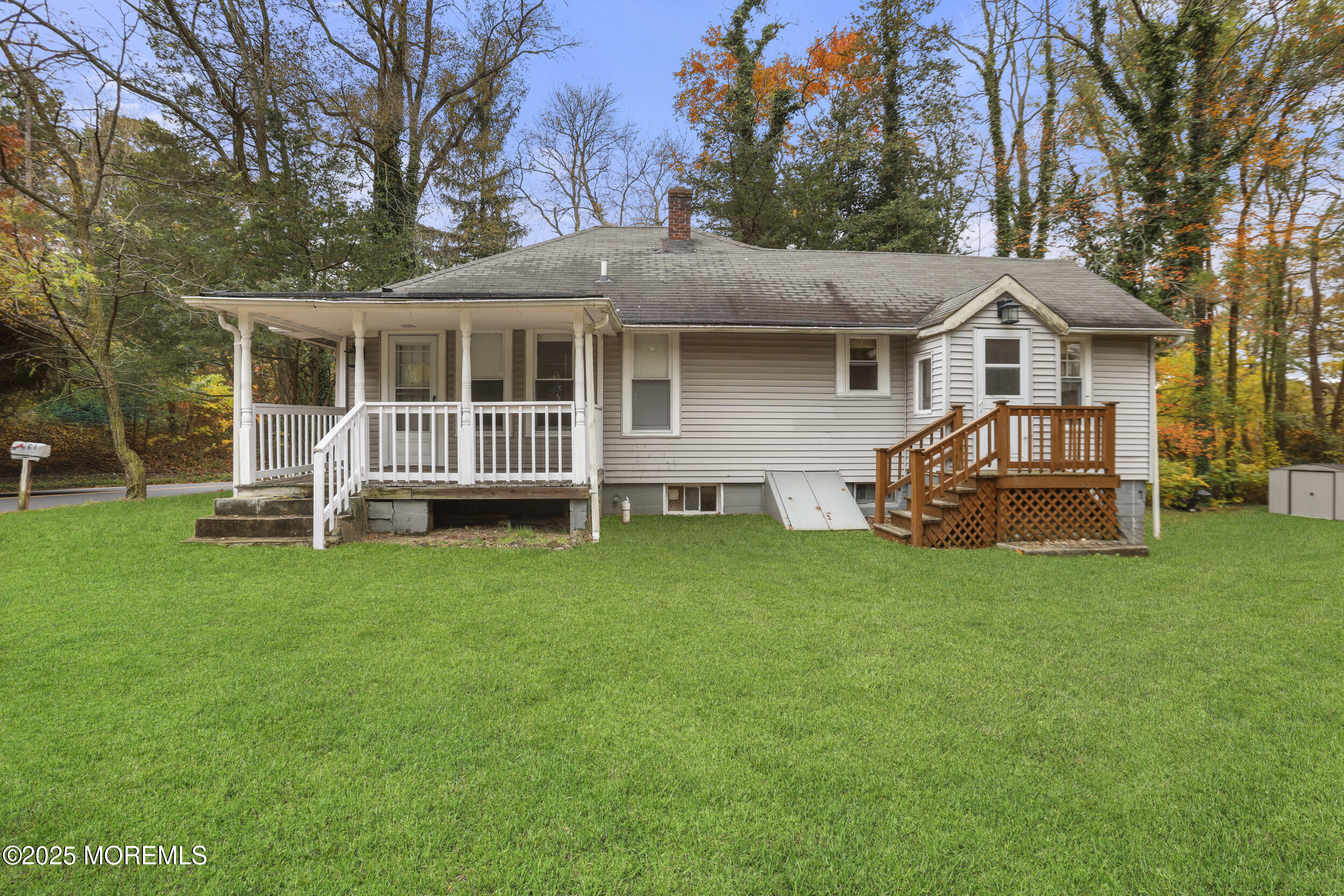 61 Cassville Road Jackson, NJ 08527 - Photo 2 of 20 a front view of a house with a garden