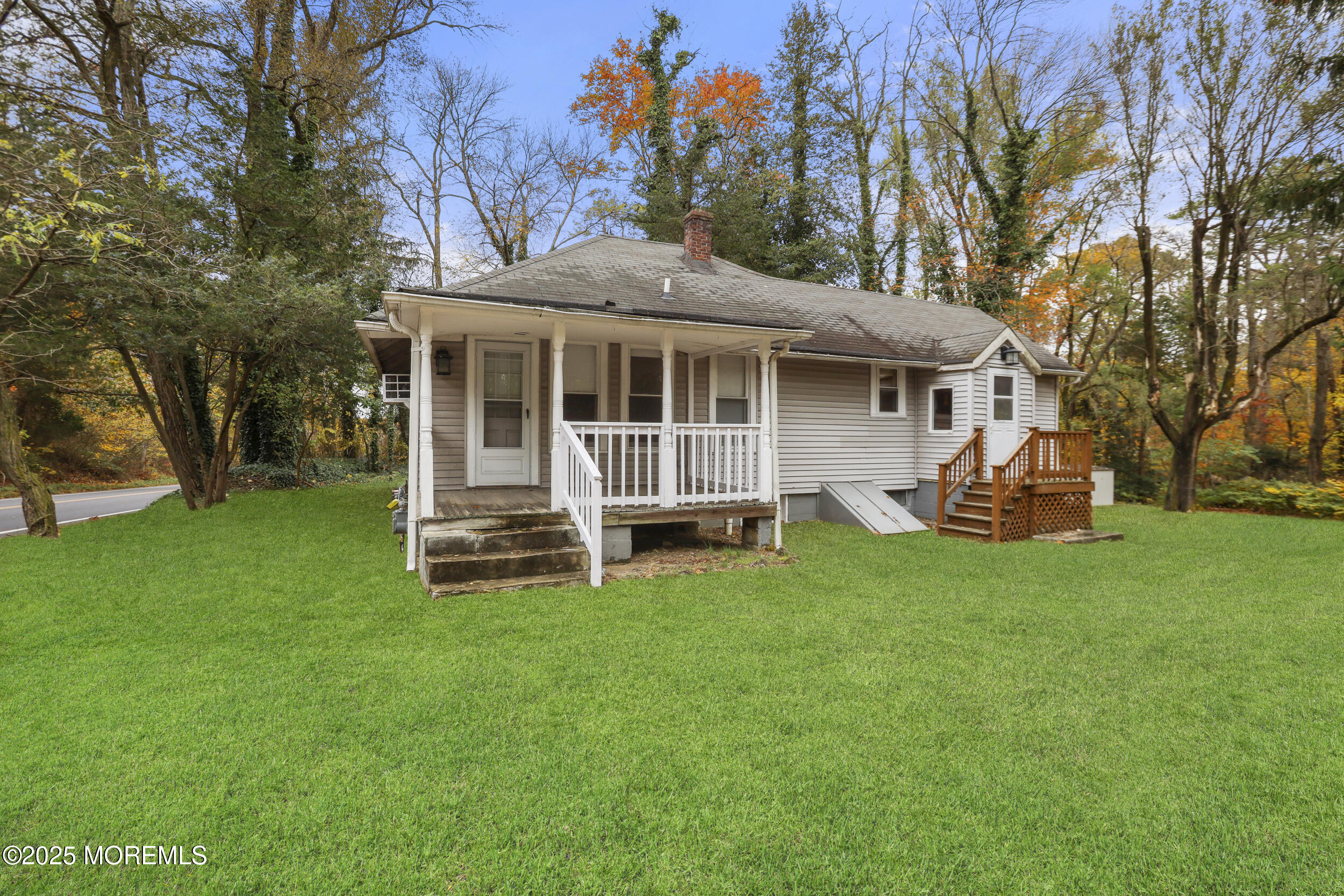 61 Cassville Road Jackson, NJ 08527 - Photo 3 of 20 a view of a house with a yard porch and sitting area