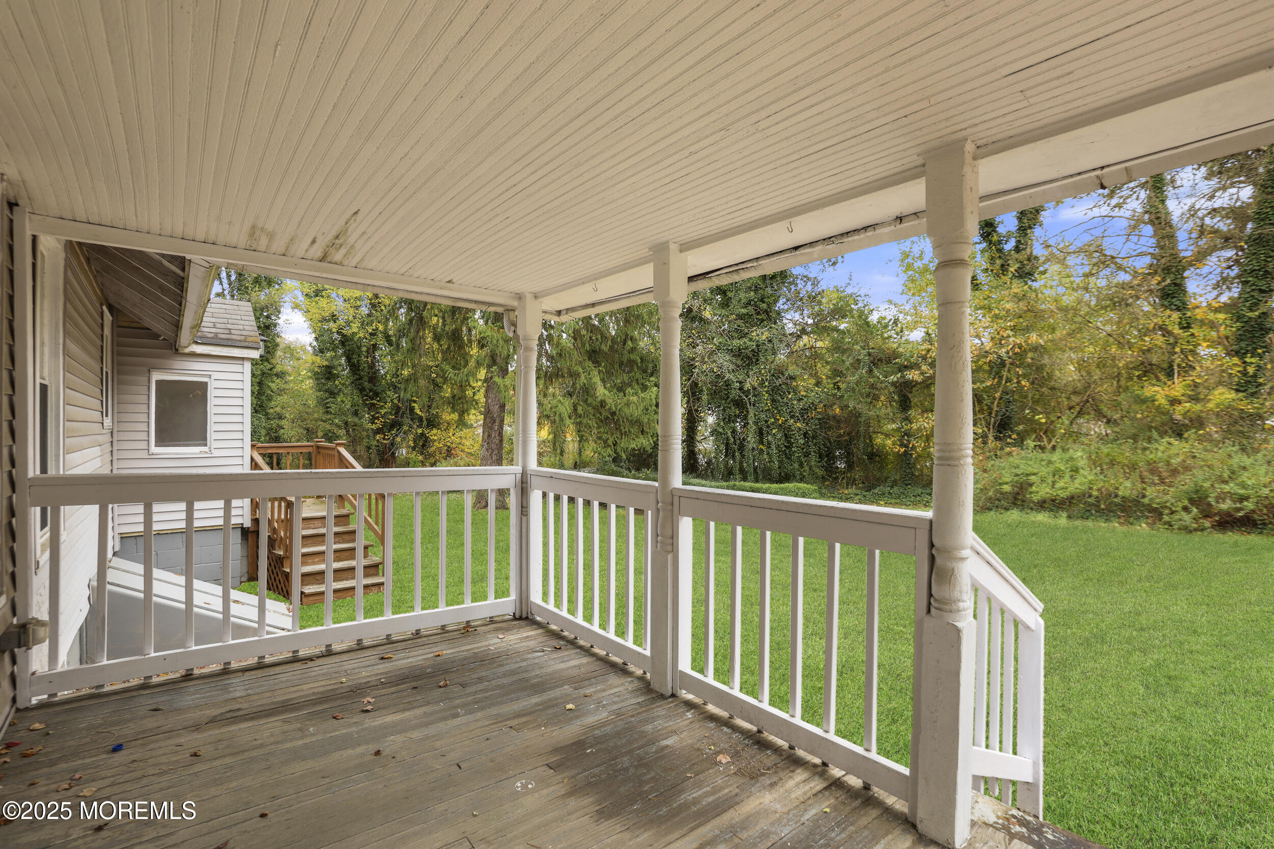 61 Cassville Road Jackson, NJ 08527 - Photo 8 of 20 a view of a balcony with wooden floor