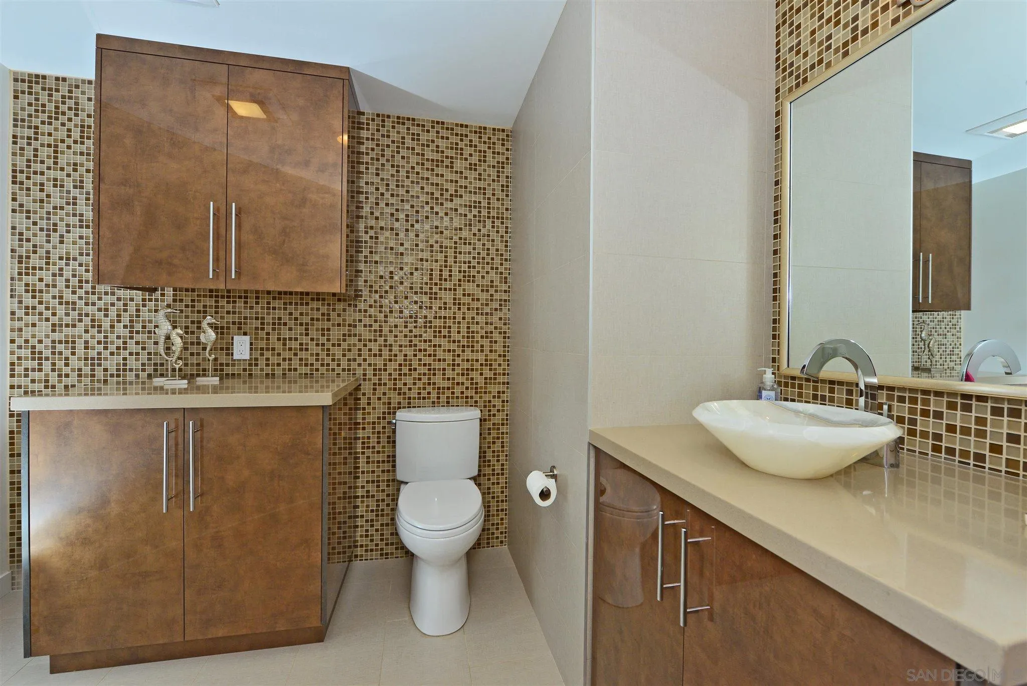 13721 Pine Needles Drive Del Mar, CA 92014 - Photo 17 of 32 a bathroom with a toilet sink and mirror