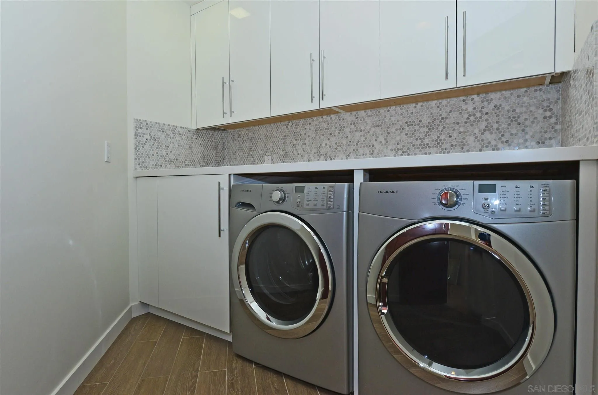 13721 Pine Needles Drive Del Mar, CA 92014 - Photo 23 of 32 a utility room with dryer and washer