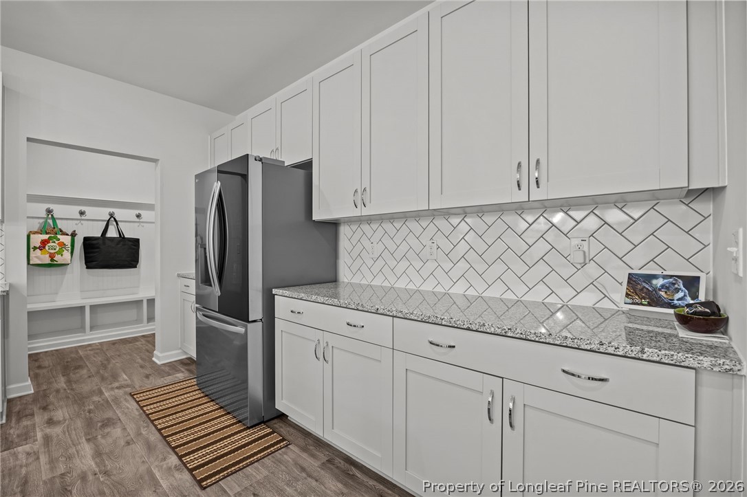 334 Beacon Hl Road Lillington, NC 27546 - Photo 15 of 49 a kitchen with granite countertop white cabinets and stainless steel appliances