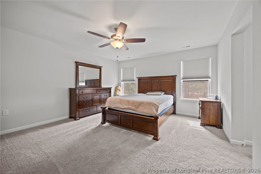 334 Beacon Hl Road Lillington, NC 27546 - Photo 20 of 49 a bed room with a bed and a window