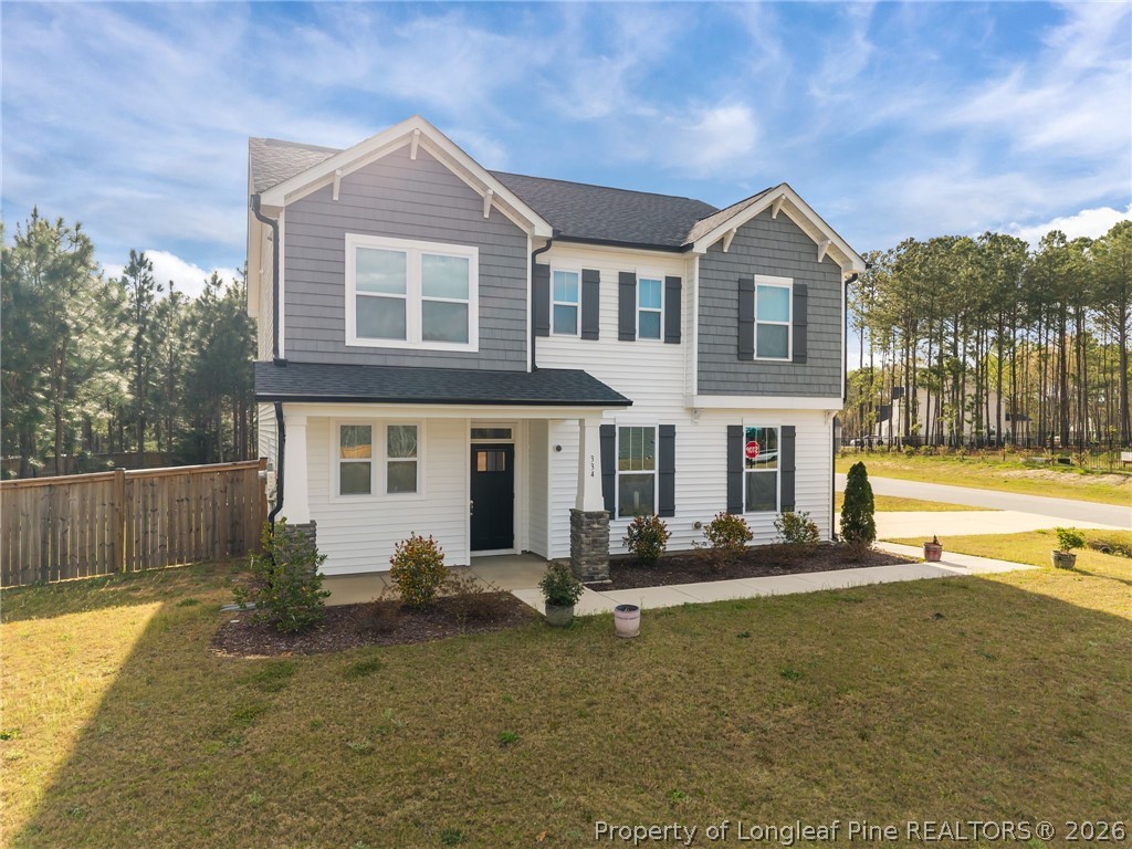 334 Beacon Hl Road Lillington, NC 27546 - Photo 40 of 49 a front view of a house with a yard