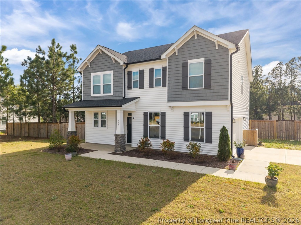 334 Beacon Hl Road Lillington, NC 27546 - Photo 41 of 49 a front view of a house with a yard