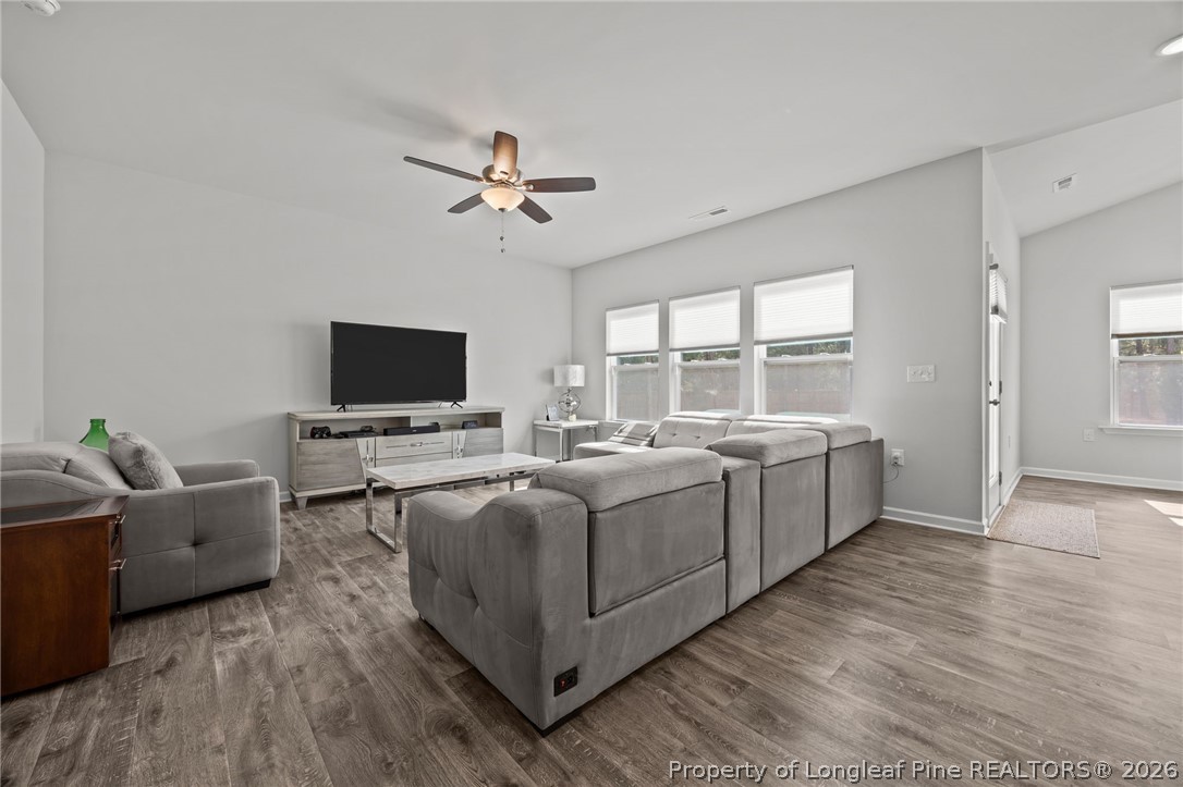 334 Beacon Hl Road Lillington, NC 27546 - Photo 7 of 49 a living room with furniture and a flat screen tv
