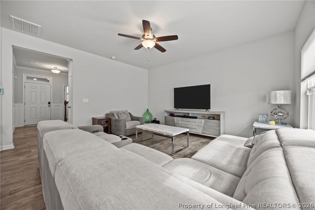 334 Beacon Hl Road Lillington, NC 27546 - Photo 8 of 49 a living room with furniture and a flat screen tv
