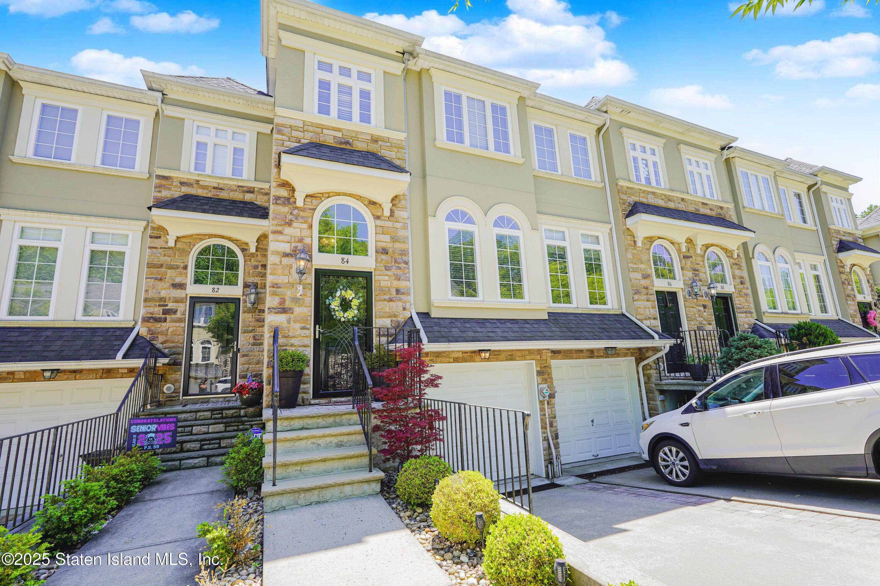 a front view of a building with garden
