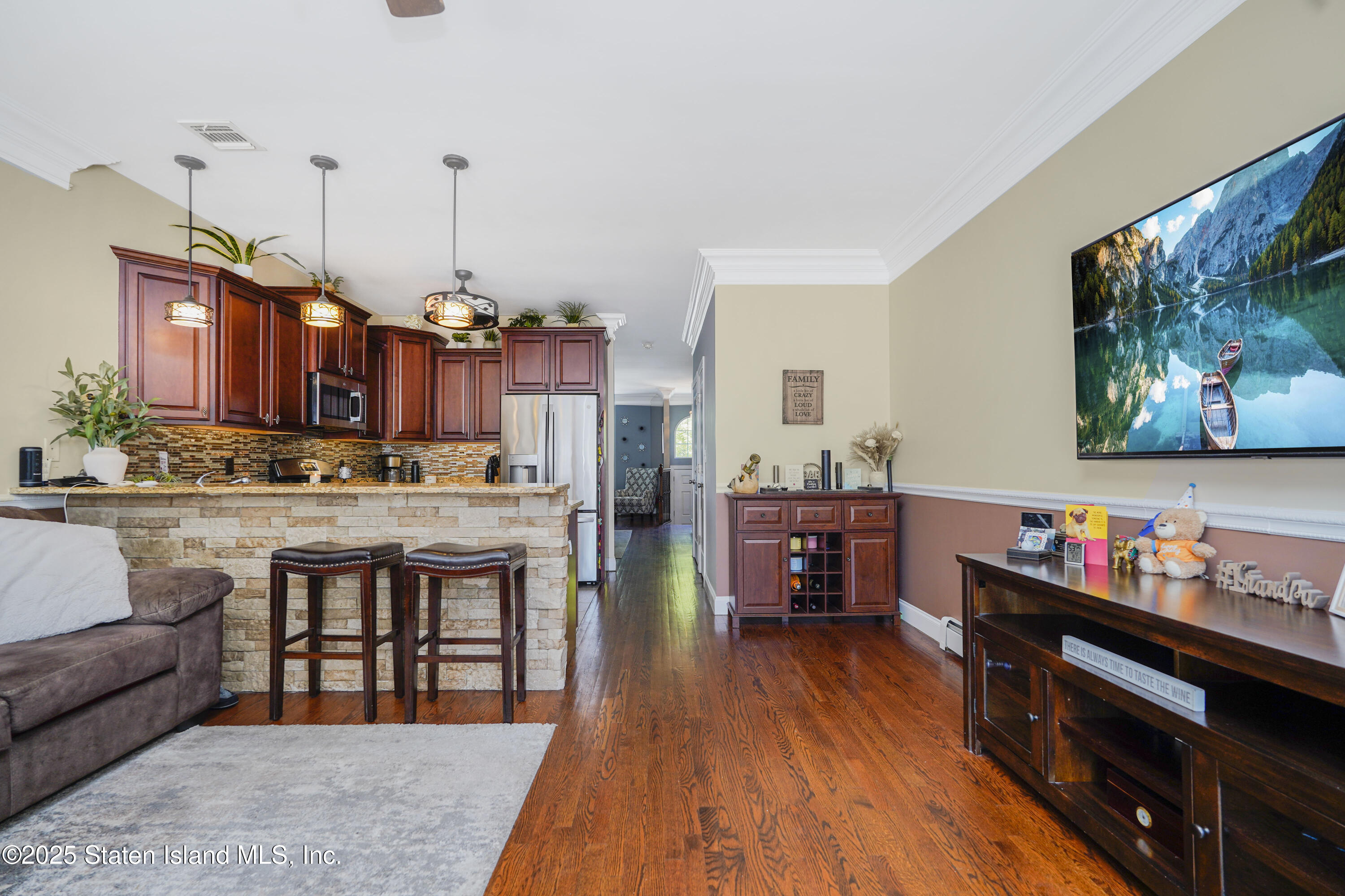 84 Presentation Circle Staten Island, NY 10312 - Photo 11 of 35 a living room with furniture and a wooden floor