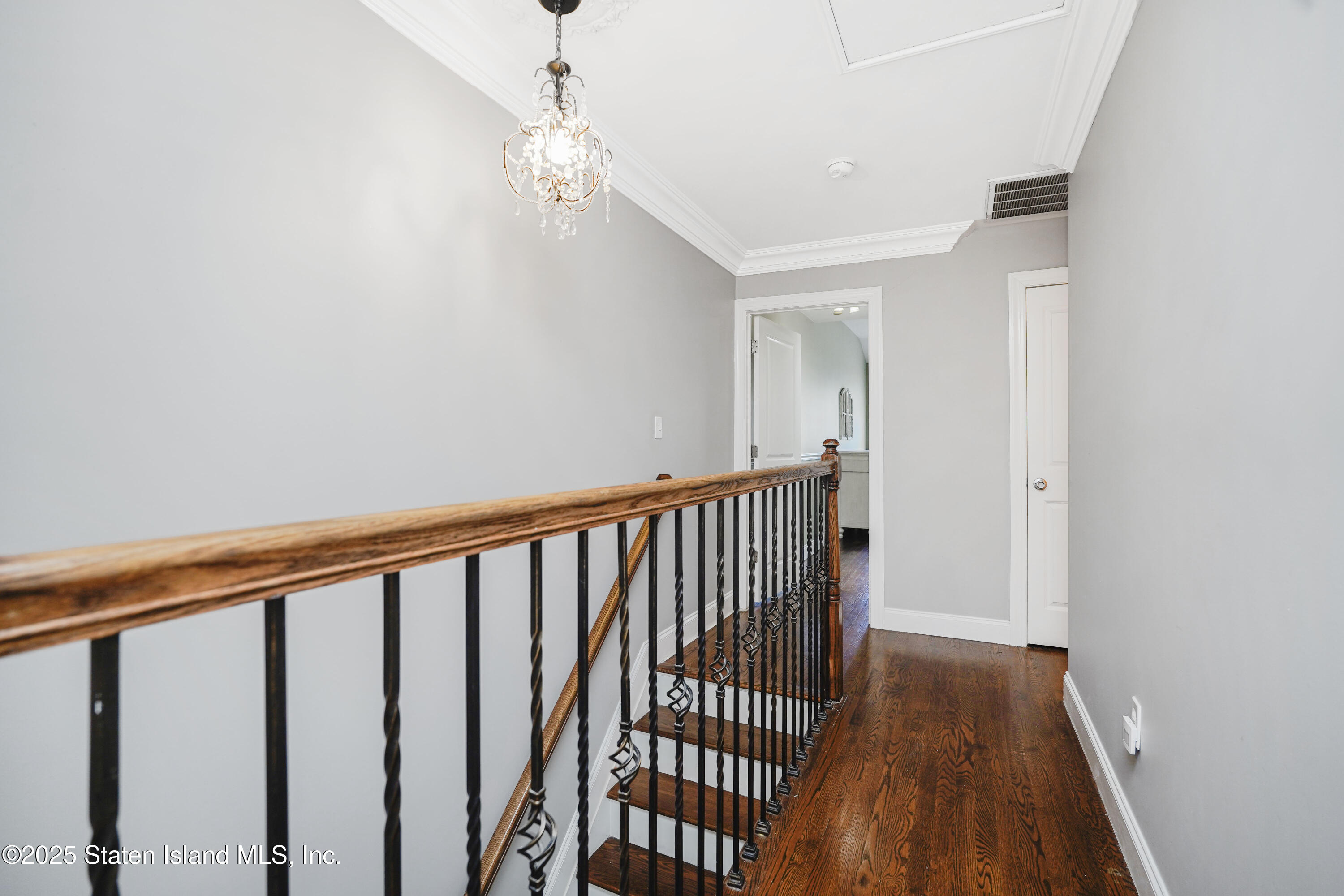 84 Presentation Circle Staten Island, NY 10312 - Photo 15 of 35 a view of a hallway with wooden floor