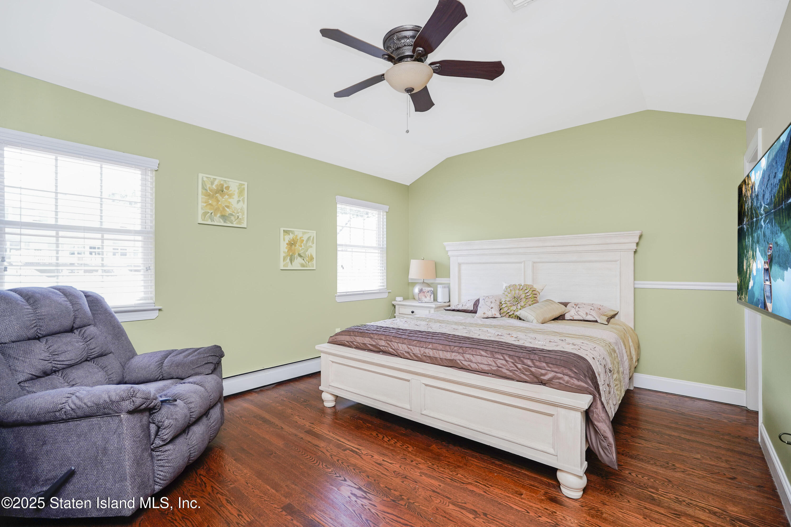 84 Presentation Circle Staten Island, NY 10312 - Photo 17 of 35 a bedroom with a bed couch and a window