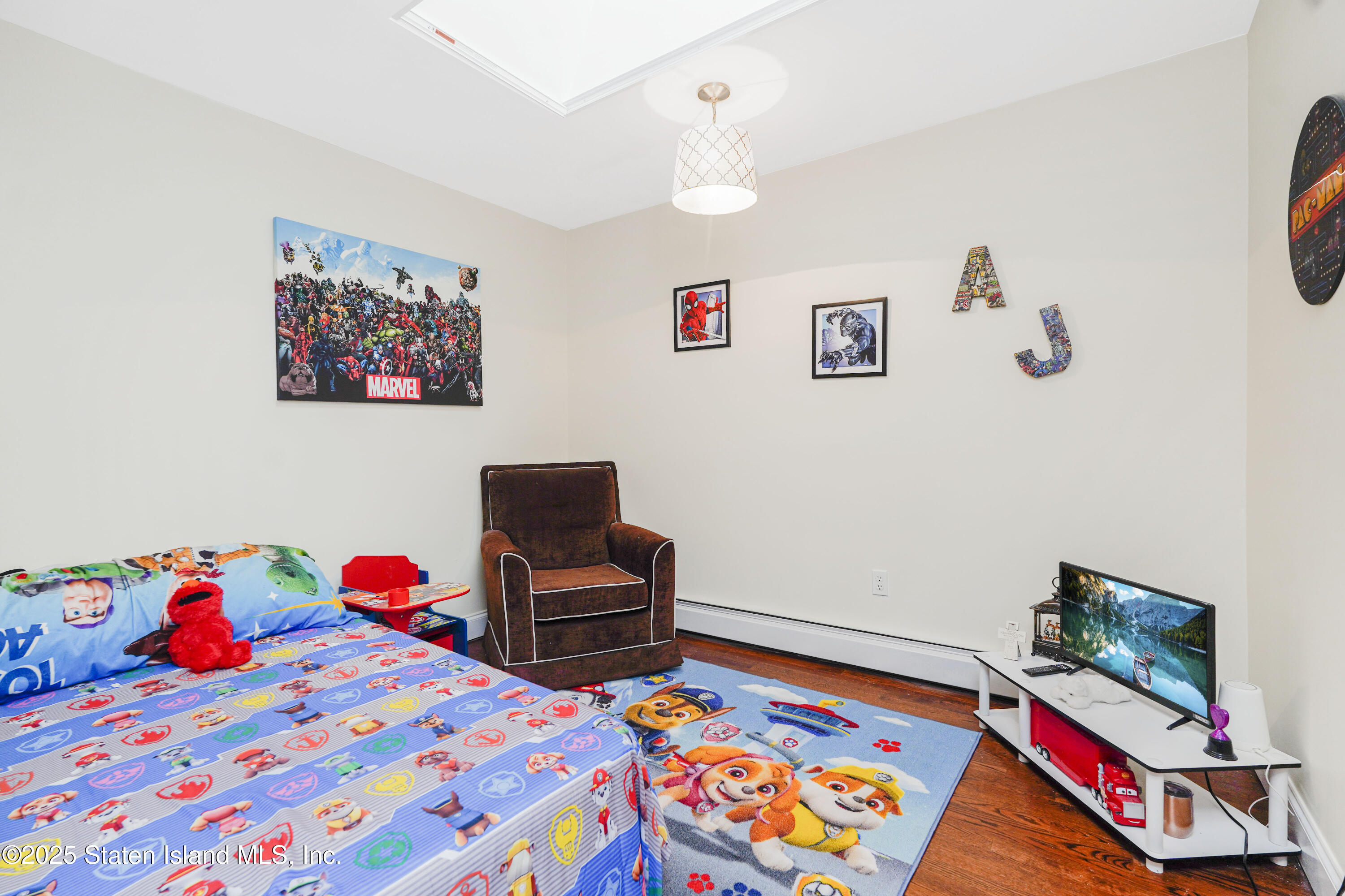 84 Presentation Circle Staten Island, NY 10312 - Photo 20 of 35 a room with furniture and a wooden floor