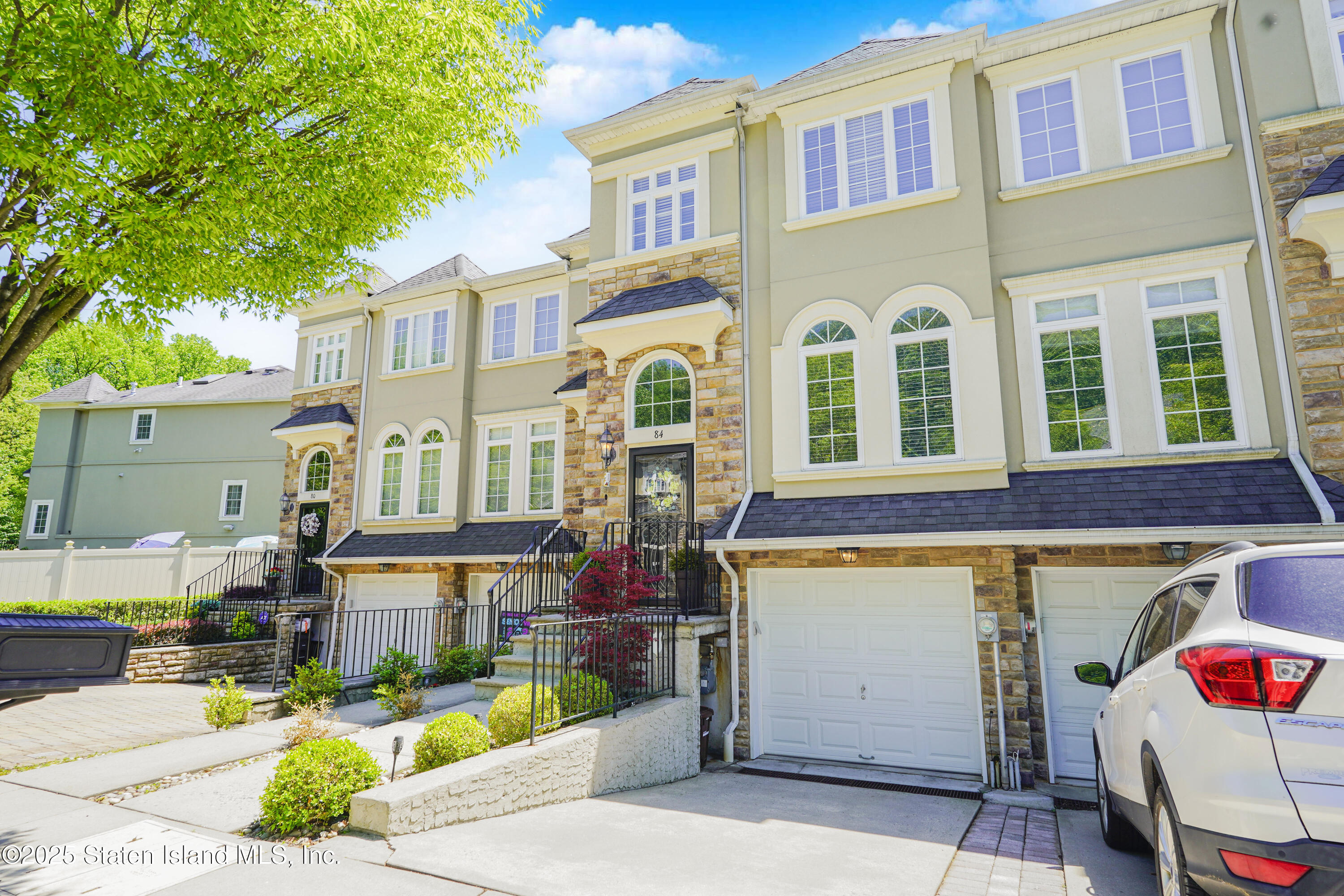 84 Presentation Circle Staten Island, NY 10312 - Photo 2 of 35 a front view of a building with street view