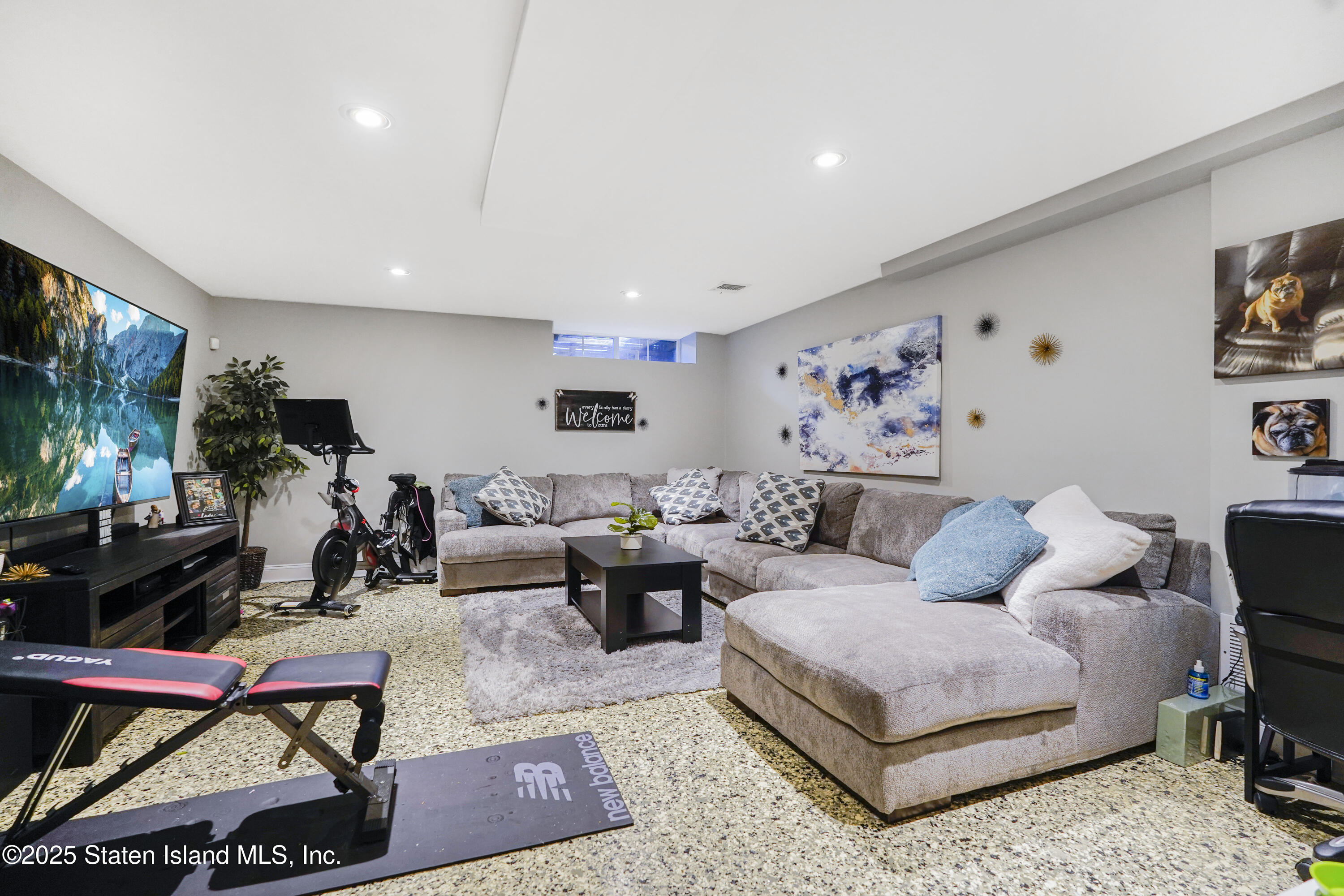 84 Presentation Circle Staten Island, NY 10312 - Photo 26 of 35 a living room with furniture and a flat screen tv