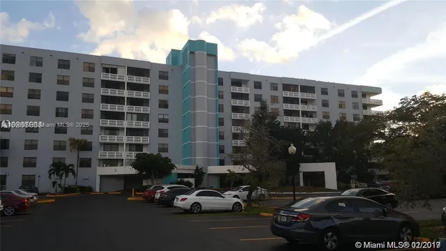 a living room with furniture flowerpot and a potted plant