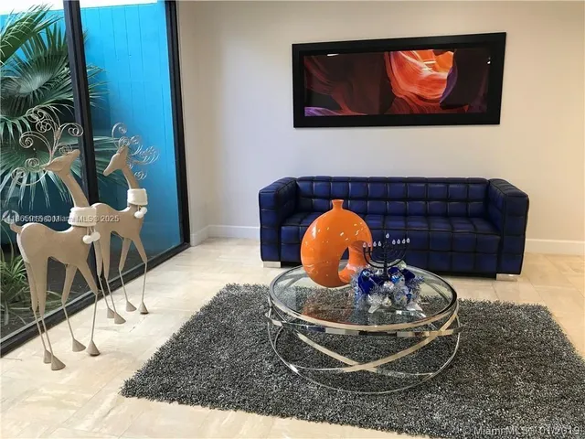 a view of a door with wooden floor