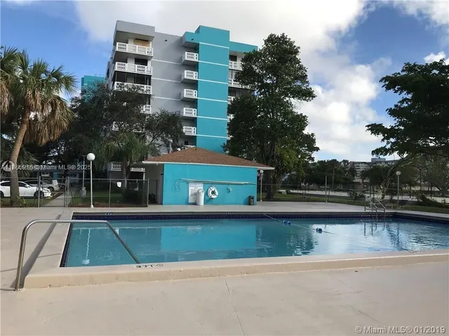 a room with lots of furniture and clutter
