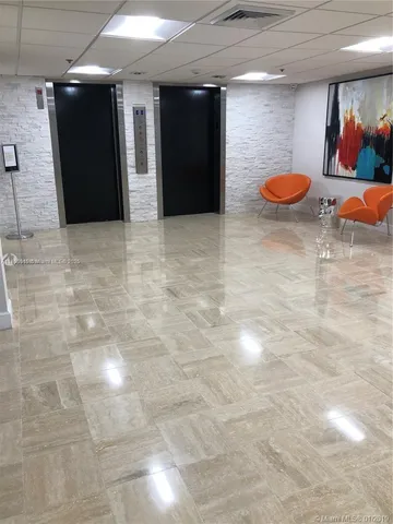 a front view of a building with tree s