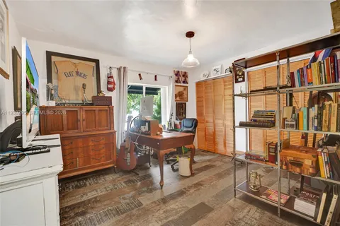 a room with furniture cabinets and a window