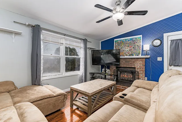 a living room with furniture and a window