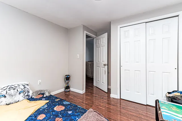 a bedroom with a bed window and a window