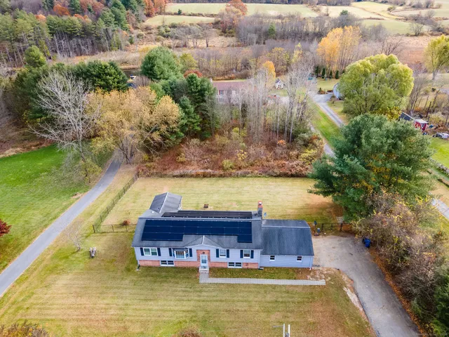 a swimming pool with trees in the background
