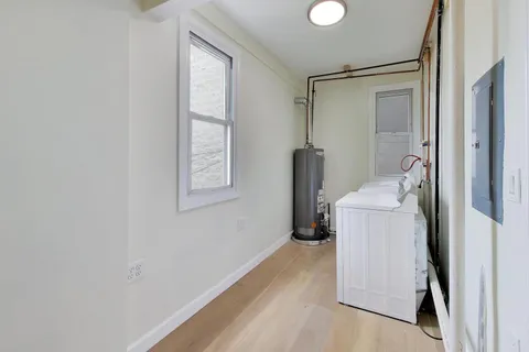 a bathroom with a sink mirror and toilet