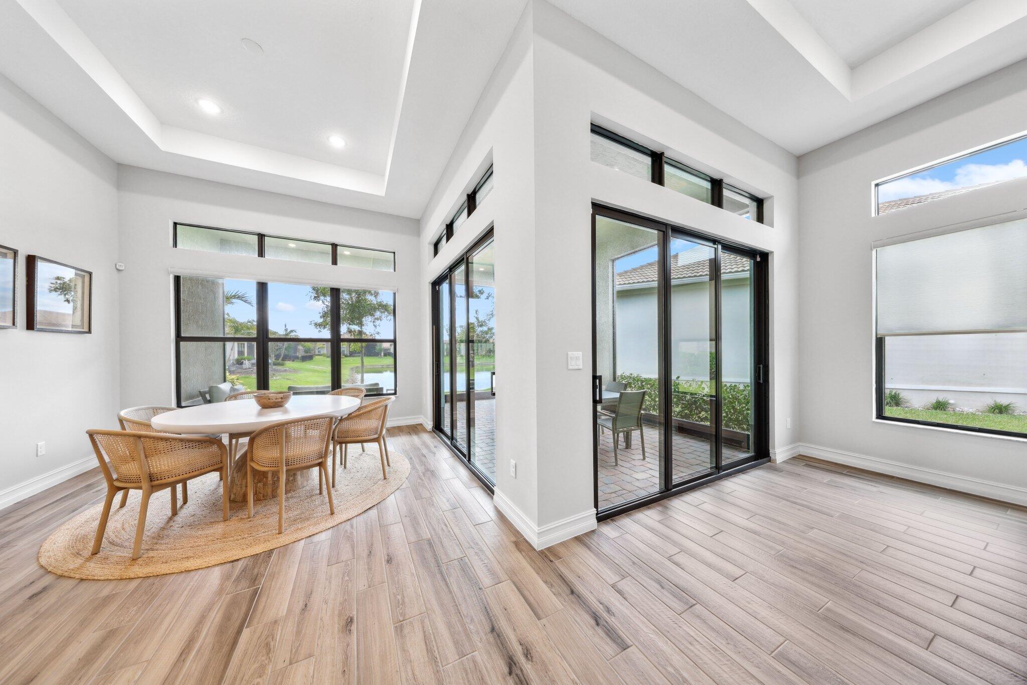 11786 Vivar Run Parkland, FL 33076 - Photo 15 of 46 a view of a livingroom with furniture and wooden floor