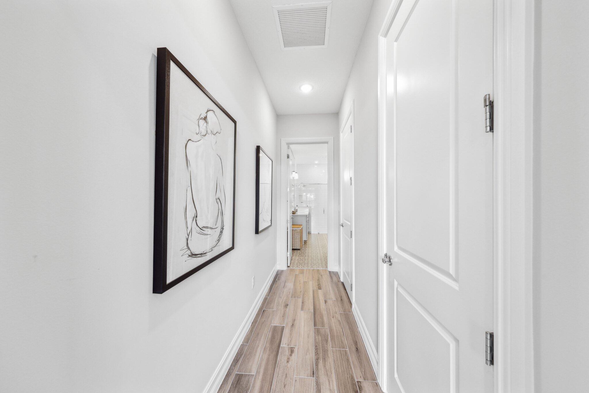 11786 Vivar Run Parkland, FL 33076 - Photo 22 of 46 a view of a hallway with wooden floor and staircase