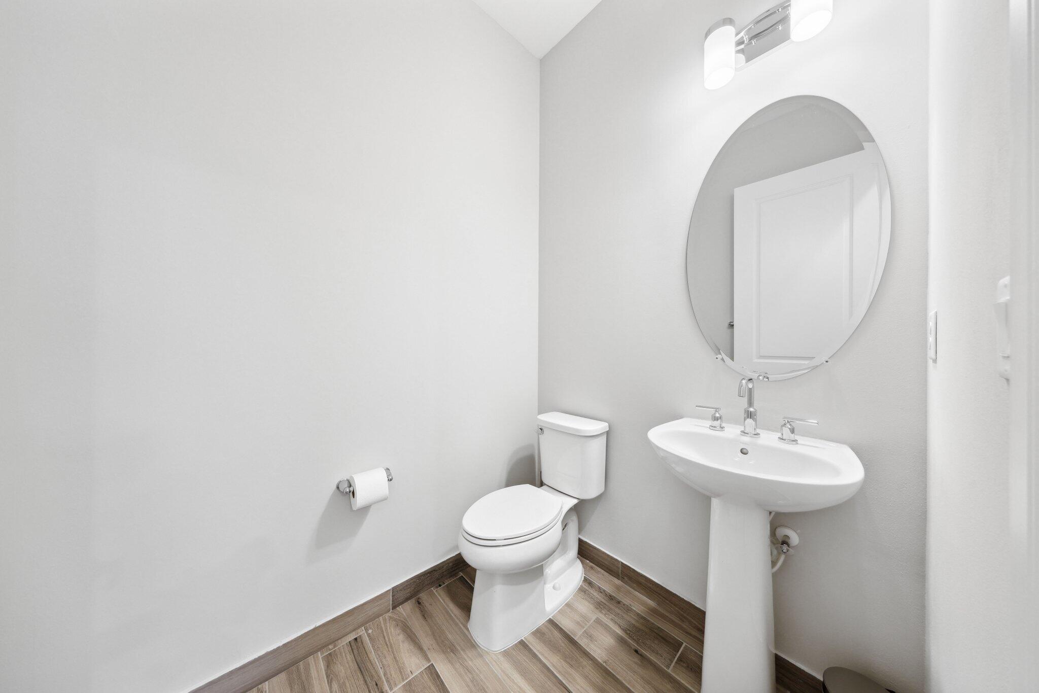 11786 Vivar Run Parkland, FL 33076 - Photo 30 of 46 a bathroom with a sink toilet and a mirror