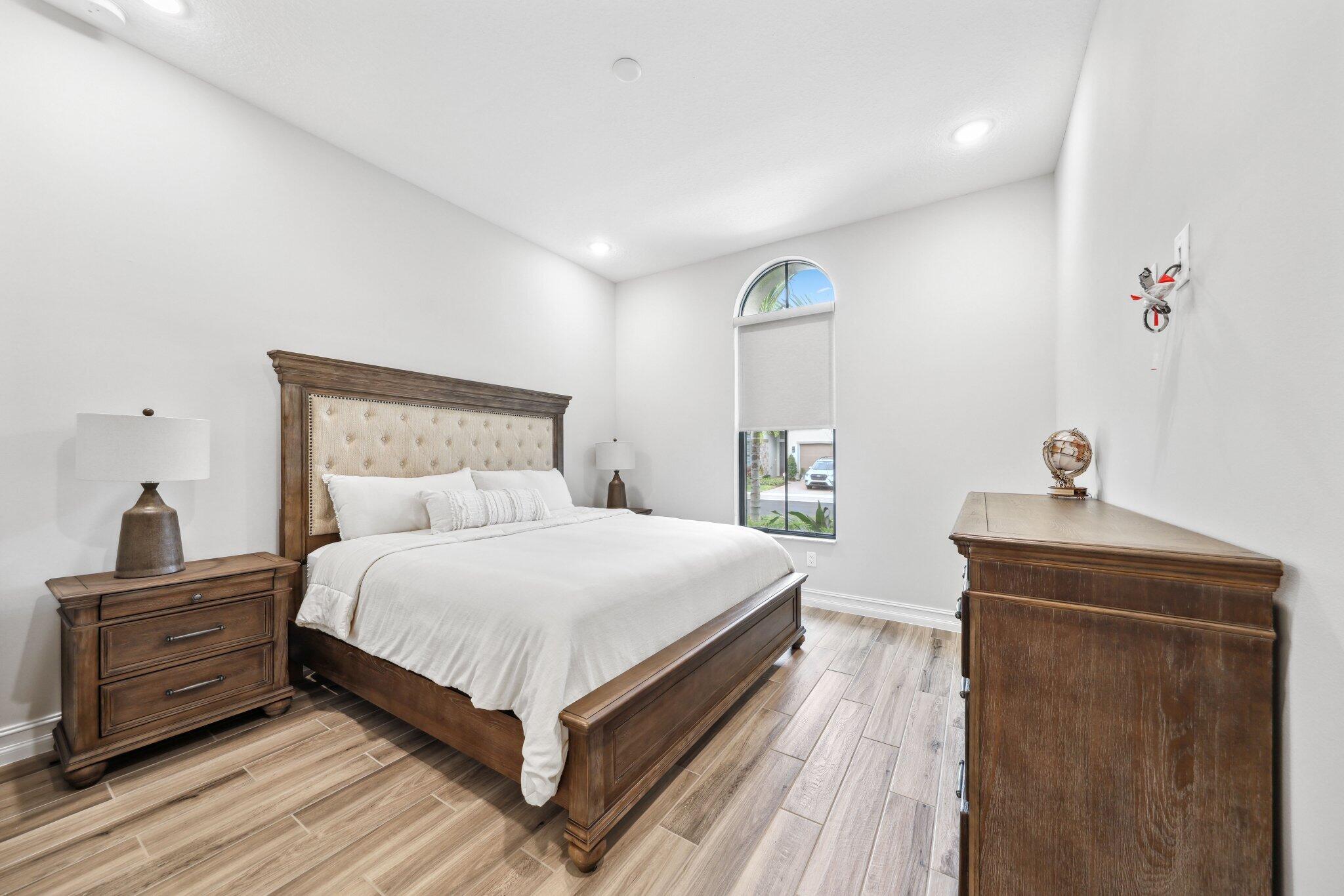 11786 Vivar Run Parkland, FL 33076 - Photo 31 of 46 a bedroom with a bed and a dresser