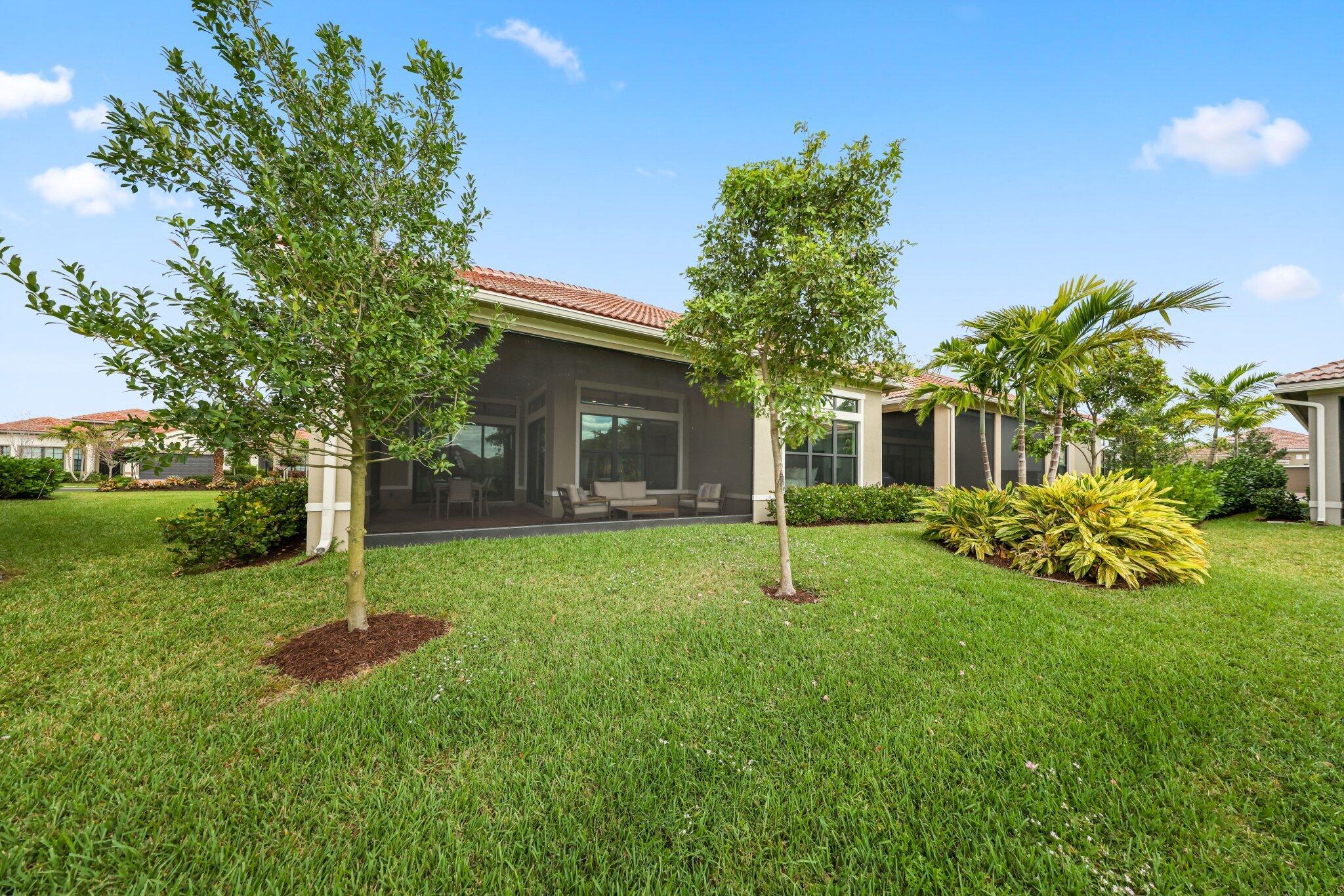 11786 Vivar Run Parkland, FL 33076 - Photo 42 of 46 a house view with a garden space