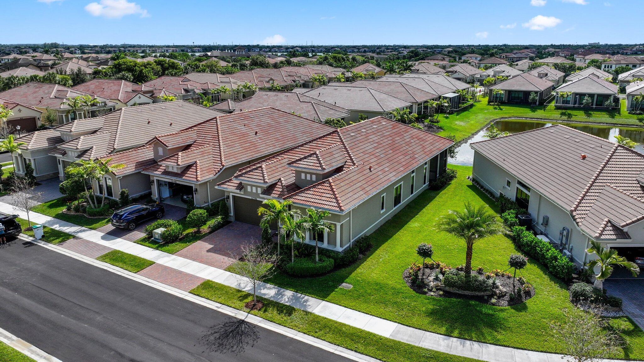 11786 Vivar Run Parkland, FL 33076 - Photo 45 of 46 an aerial view of multiple houses with a yard