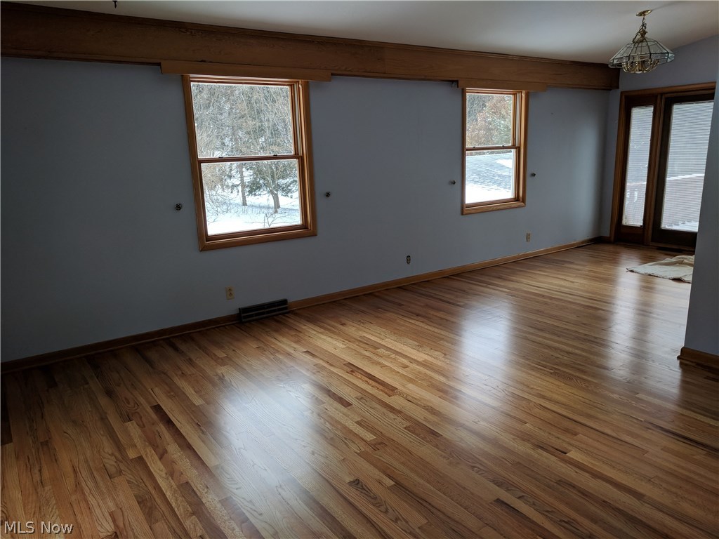 2459 Lansinger Road Mogadore, OH 44260 - Photo 5 of 21 This picture is from the living room looking into the dining space. The doors go out to the deck. Grilling year round would be easy.