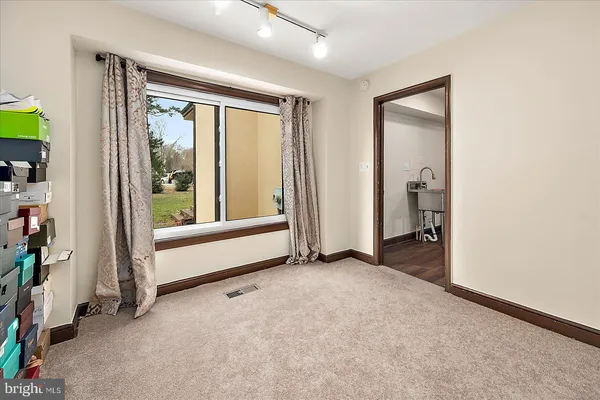 a bed room with a bed and a window