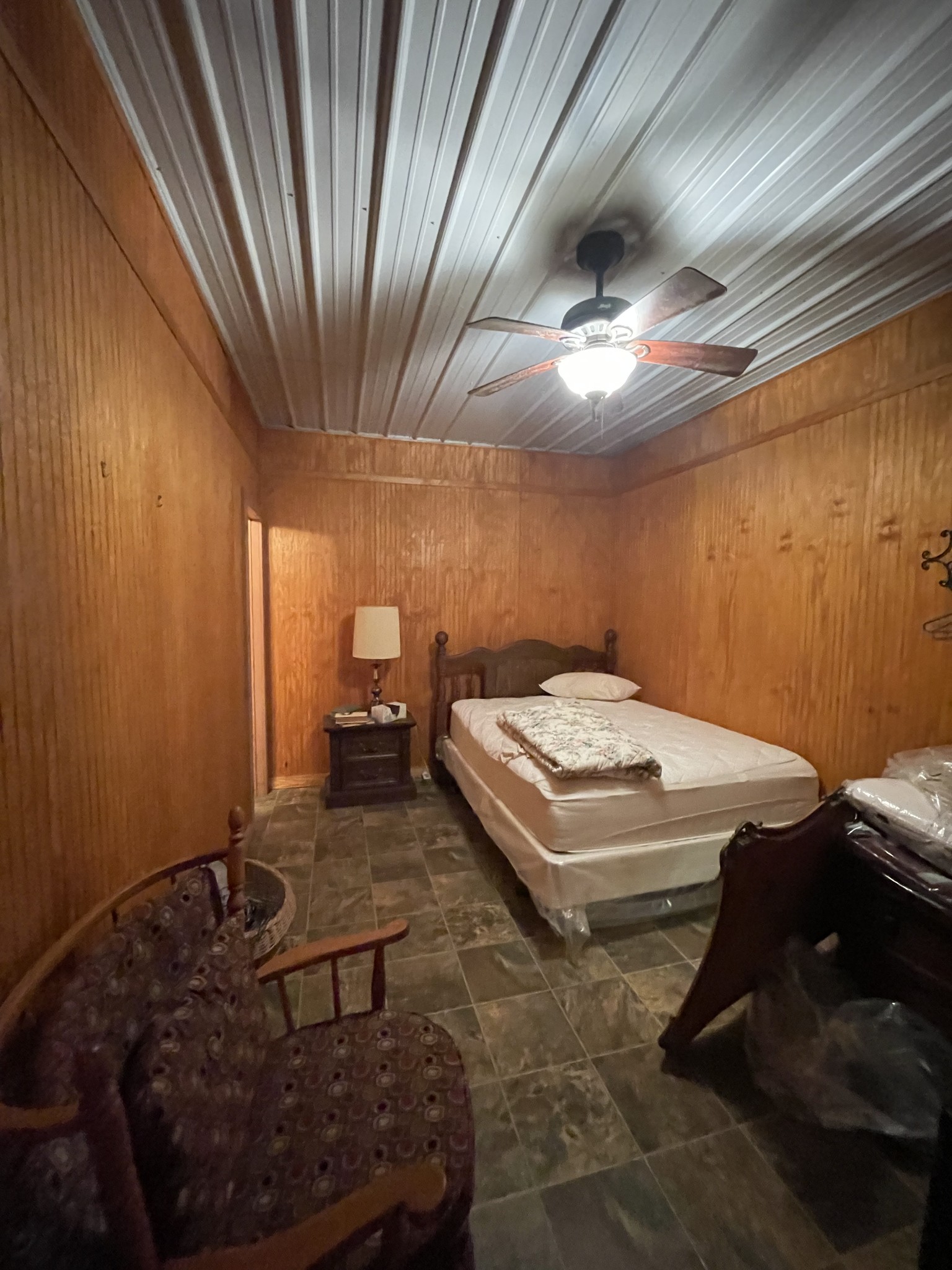 1733 Pump Station Road New Johnsonville, TN 37134 - Photo 12 of 20 a bedroom with a bed and a chandelier