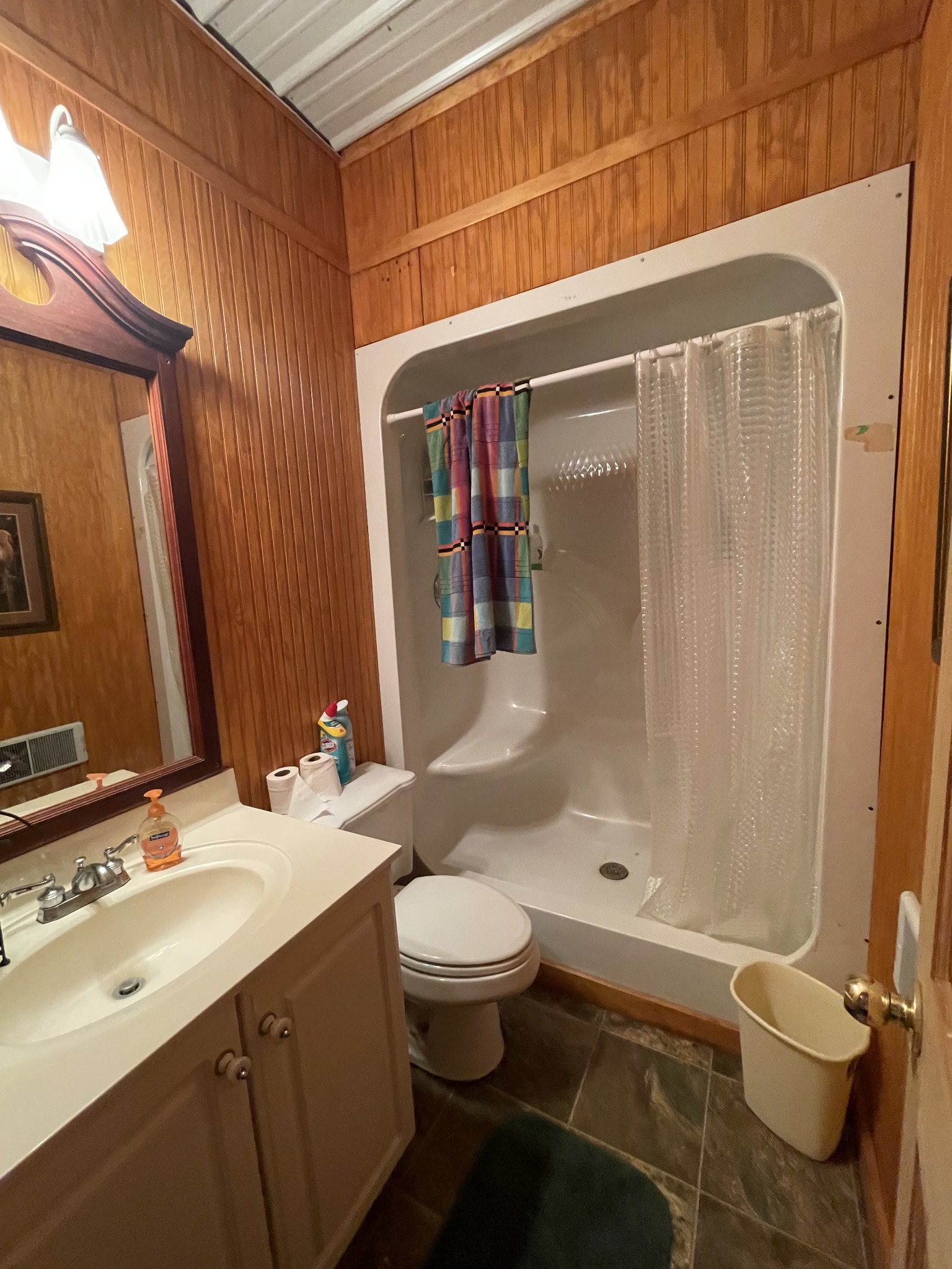 1733 Pump Station Road New Johnsonville, TN 37134 - Photo 14 of 20 a bathroom with a sink a toilet and shower